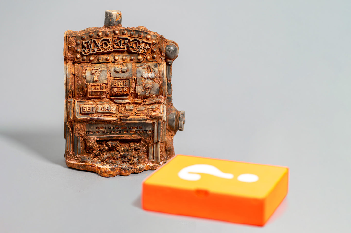 Sculpture displayed with orange box revealing interior surprise element