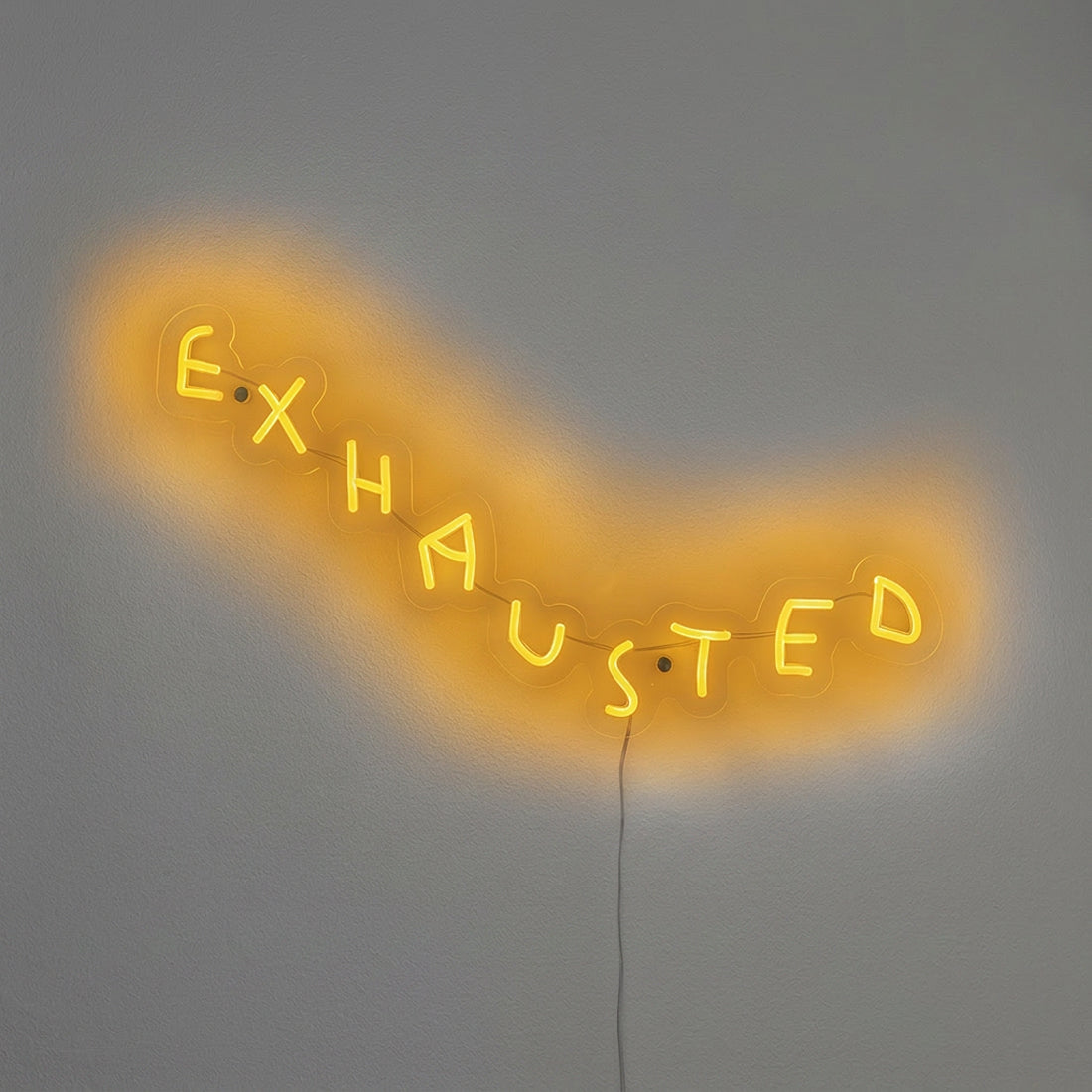 EXHAUSTED limited edition neon artwork by Wasted Rita in yellow light