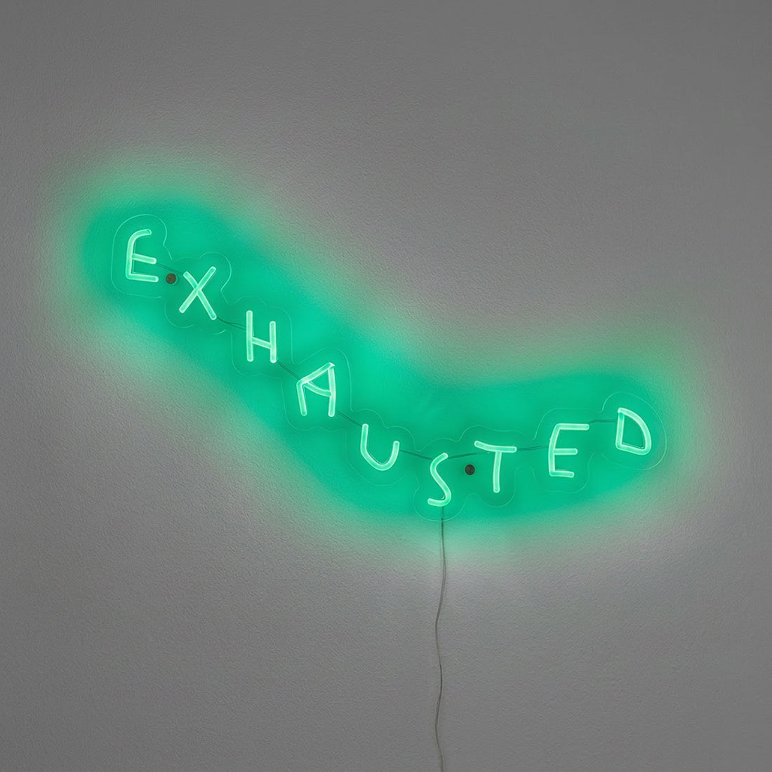 EXHAUSTED neon sculpture by Wasted Rita illuminated in green