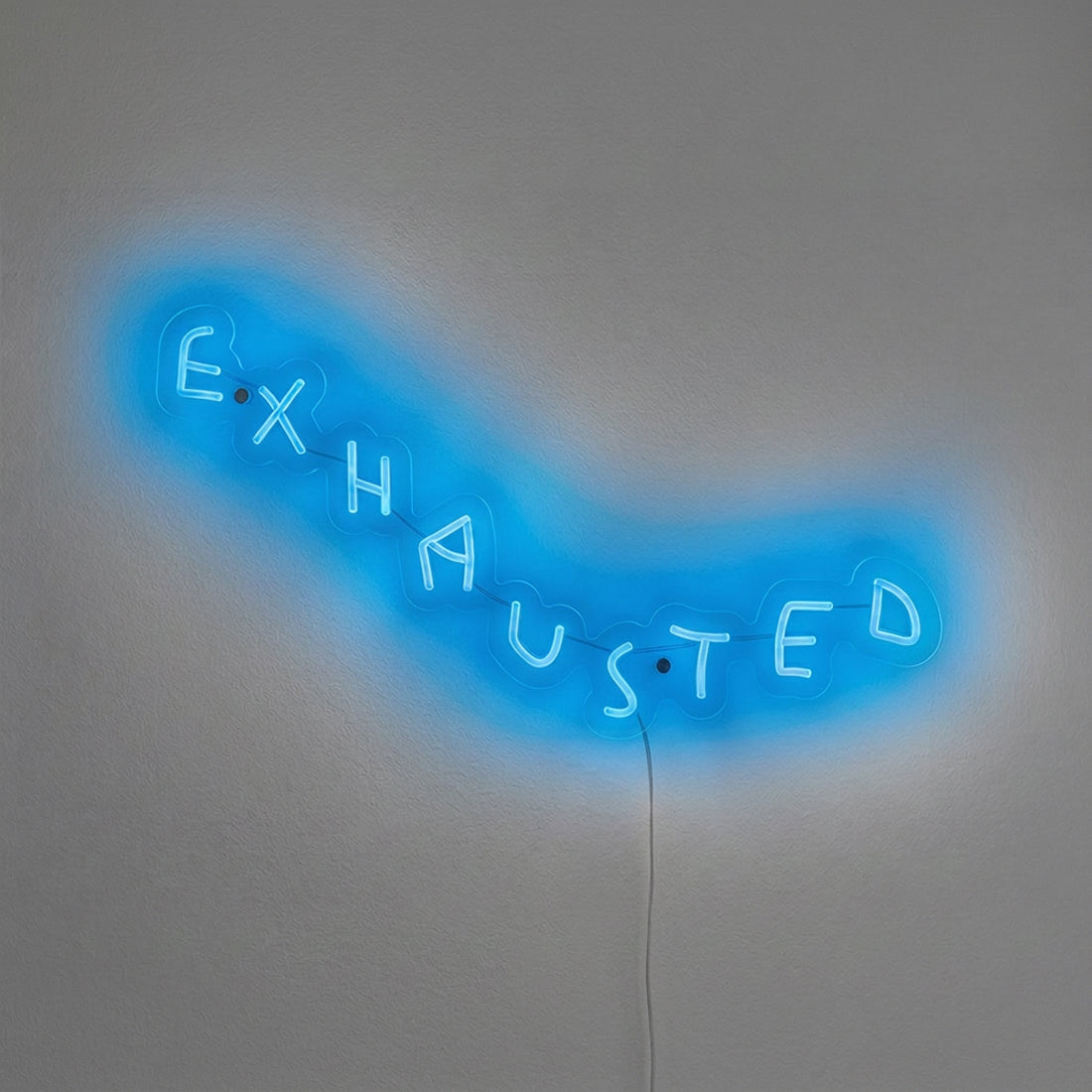 EXHAUSTED neon wall sculpture by Wasted Rita illuminated in blue