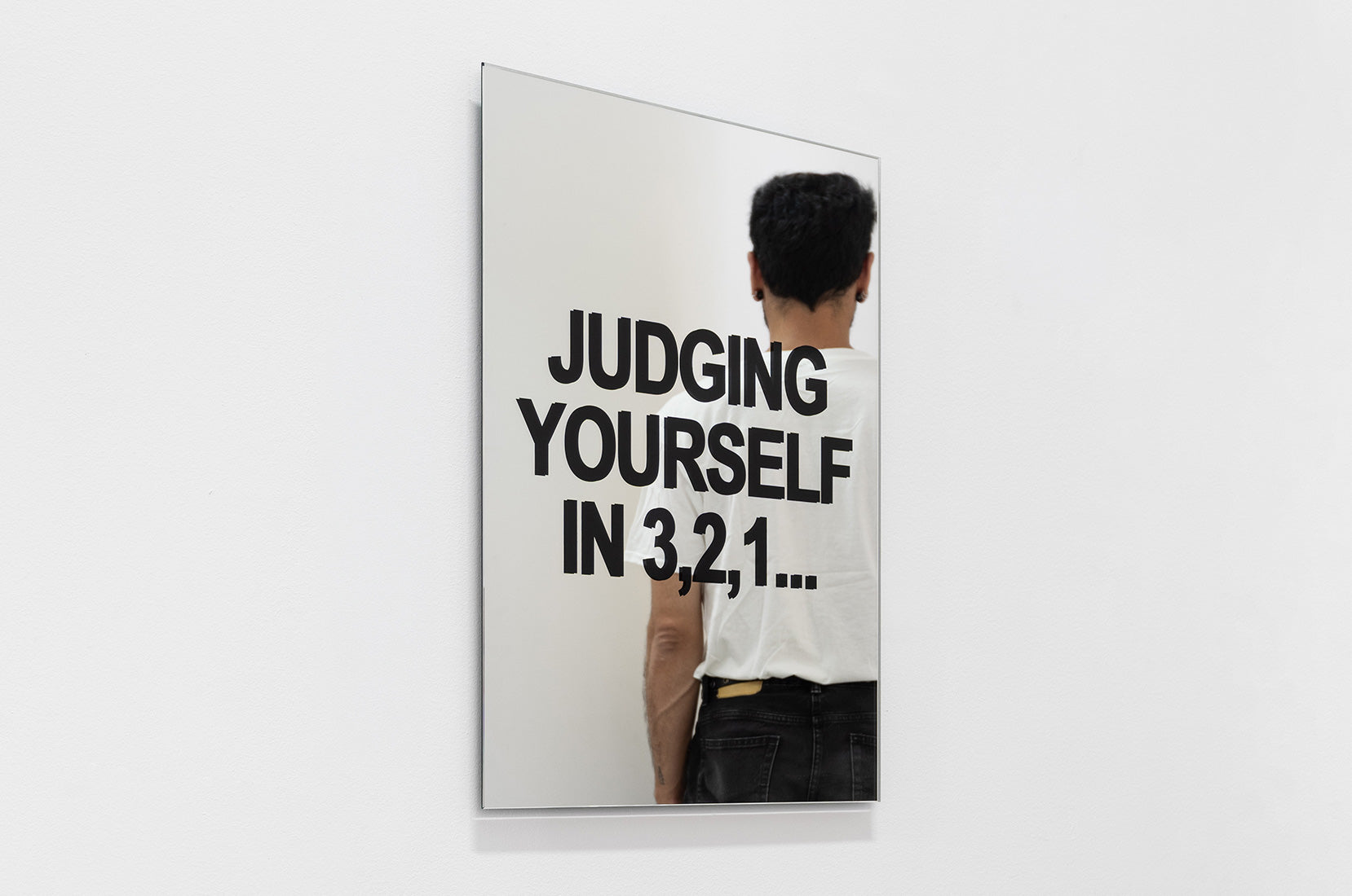 The Countdown mirror artwork by Octavi Serra displayed with collector for scale