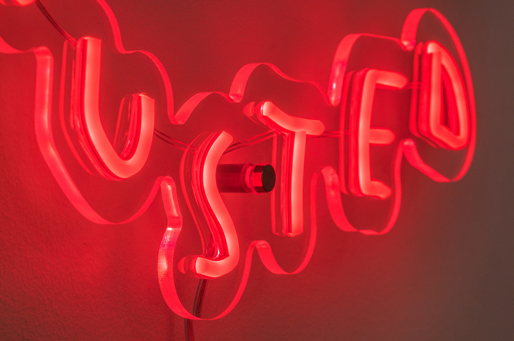 Detail of EXHAUSTED neon artwork by Wasted Rita laser-cut acrylic and neon tubing