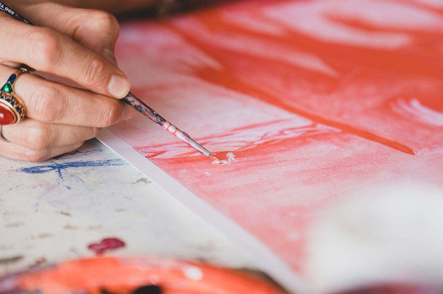 Detail – hand working on print surface, finishing process