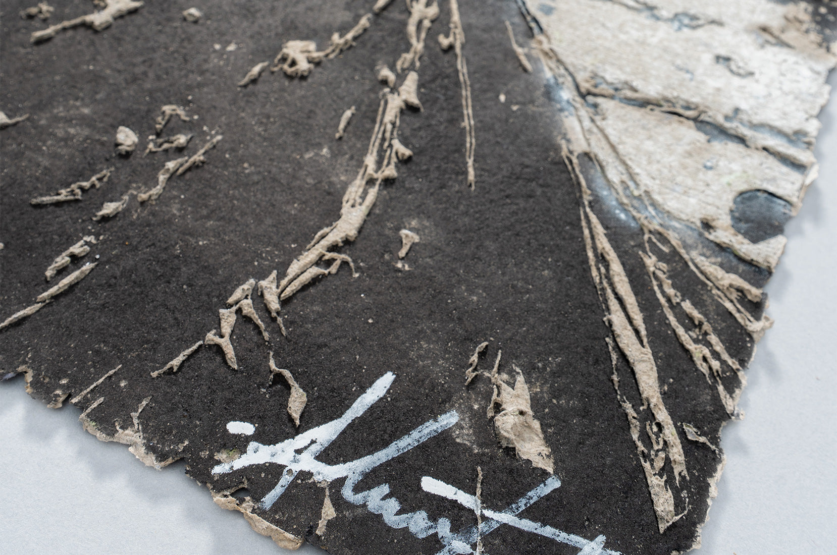 Surface detail of Lexicon by Vhils –  papier-mâché artwork, Underdogs Gallery